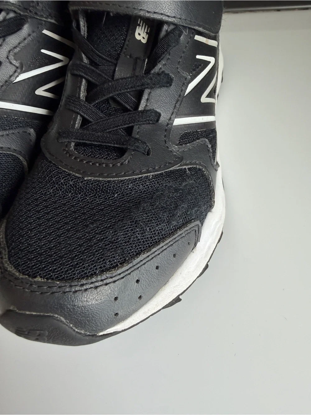 New Balance Kids Black and White Sneakers